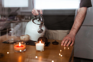 Young man prepares chinese pu-erh tea for the tea ceremony