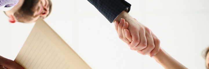 Partners shake hands over business agreement, successful deal between biz partners