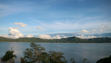 Naklejka premium stunning lake tondano surrounded by beautiful hills