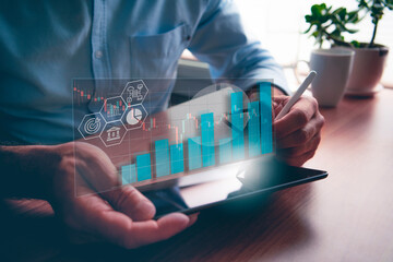 businessman holding tablet with analytical data, business intelligence and data visualisation concepts