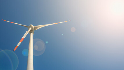 Big wind turbine to generate electrical power as green ecofriendly energy at blue deep sky and...