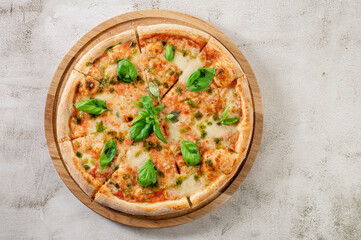 Fresh hot cheese pizza on the concrete background