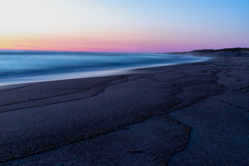 Blue hour after sunset on the beach and sea