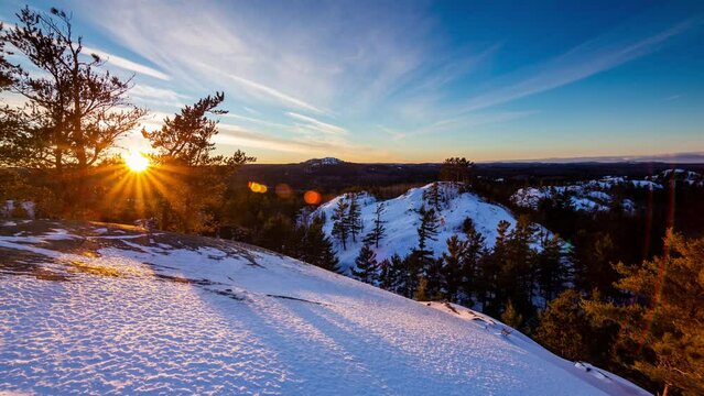 Sunset time-lapse over snow covered hills, Upper Peninsula of Michigan 4K