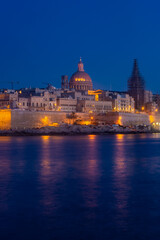 Naklejka na ściany i meble Skyline of Valletta by night, view from Sliema, Malta