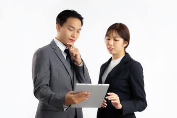 Asian businesspeople man and woman looking at lablet on white background.
