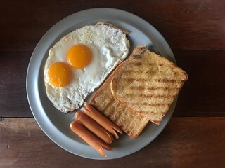 fried egg and pork sausage 