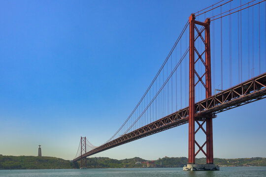 25 April suspension bridge over the Tagus River and Almada Christ, Lisbon
