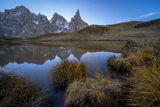 Cimon della Pala reflected in a lake, Rolle Pass, Dolomites, Trentino, Italy