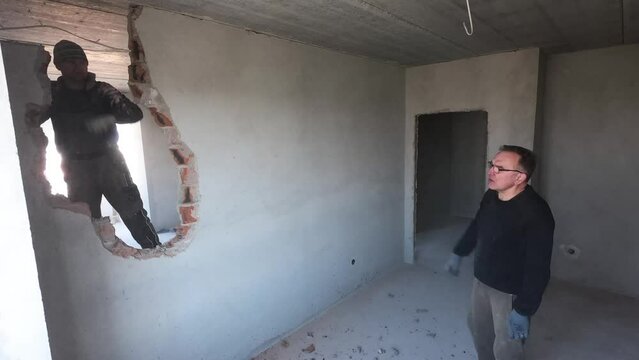 Time lapse process of destroying wall in apartment under renovation. Demolition work and home renovation concept.