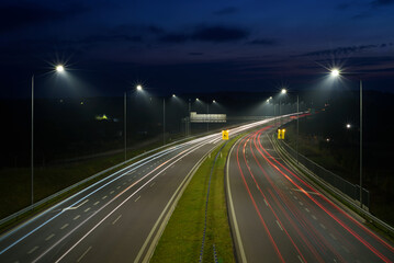 Fototapeta na wymiar ON THE ROAD AT MORNING - Car traffic on a modern expressway 
