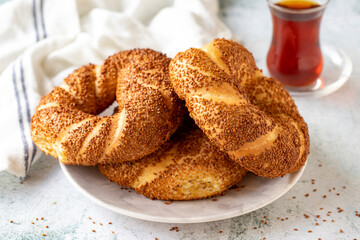 Turkish bagel or gevrek. Traditional flavors. Turkish street food circular bread, bagel with sesame. Close up