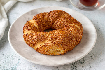 Turkish bagel or gevrek. Traditional flavors. Turkish street food circular bread, bagel with sesame. Close up