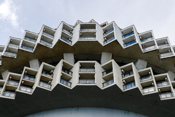 YALTA, Crimea - March 4, 2022: Beautiful modern concrete round building in cogwheel style of Kurpaty sanatorium in Yalta - obrazy, fototapety, plakaty