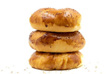 Turkish bagel pogaca with nigella seeds. Traditional flavors. Pogaca isolated on white background. close up