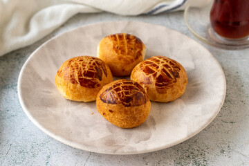 Turkish little pogaca. Traditional flavors. Pogaca on gray background. close up