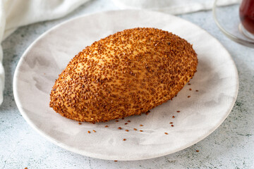 Turkish sesame and cheddar pogaca. Traditional flavors. Pogaca on gray background. close up