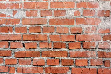 Old brick cracked wall background texture.
