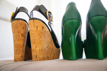 Group of shoes with high heels, color green and black