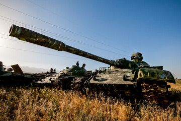 War in Afghanistan. The road to Jalal-Abad in Afghanistan and the cemetery of military equipment