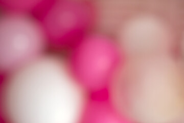 Blurred horizontal background of festive decoration of balloons on a white background