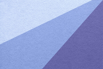 Old craft navy blue, very peri and violet color paper background, macro. Vintage abstract lavender cardboard