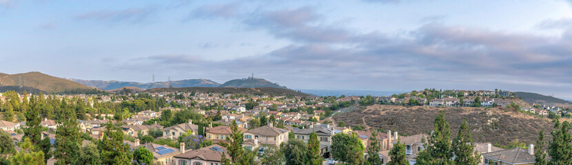 Fototapeta na wymiar Panoramic view of upper middle class suburban neighborhood at Double Peak in San Marcos, CA