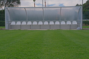 a bench on the green field © onur