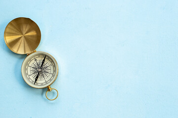 Fototapeta na wymiar Golden vintag compass top view. Direction choice concept