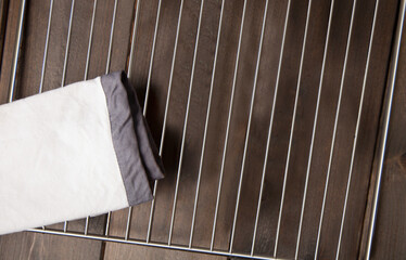 empty oven wire rack on a wooden table, top view