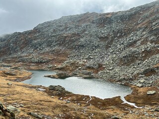 View of the alpine lake Laghi d'Orsirora in the autumn atmosphere in the mountainous area of the St. Gotthard Pass (Gotthardpass), Airolo - Canton of Ticino (Tessin), Switzerland (Schweiz)