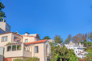 Fototapeta na wymiar Side view of large mediterranean residential buildings on a slope at San Francisco, California