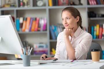 Business woman using PC at workplace in office. Career Concept