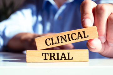 Wooden blocks with words 'Clinical Trial'.