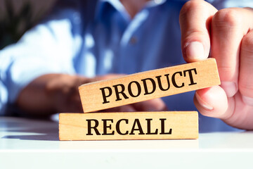 Wooden blocks with words 'Product Recall'.