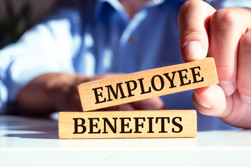 Wooden blocks with words 'Employee Benefits'.