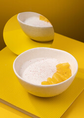 porridge with pineapple on a yellow background