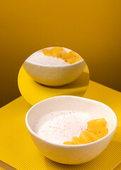 porridge with pineapple on a yellow background