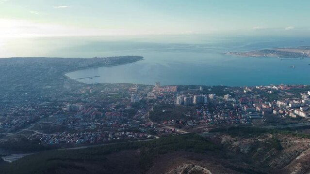 View of the city of Gelendzhik from a bird's eye view at sunset, flying from a drone