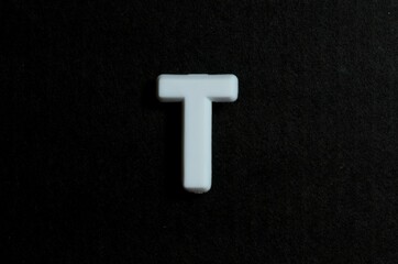 Letter T on a black background