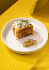 casserole with vegetables on a yellow background