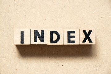 Alphabet letter block in word index on wood background