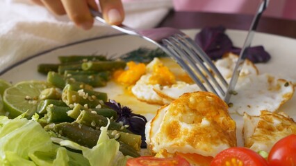 Hearty and healthy breakfast of scrambled eggs with vegetables. A healthy and balanced diet for an adult starts in the morning for breakfast to nourish the body with useful microelements.
