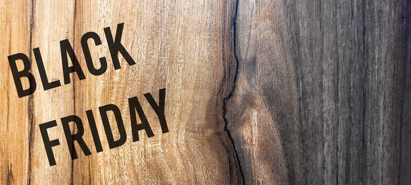 Black friday rustic wooden background, big black letters, sales promotion