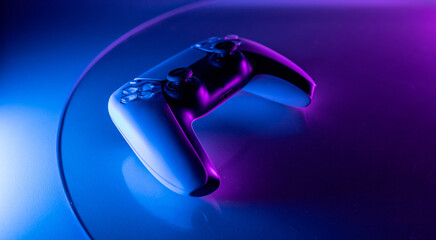  abstract joystick or gamepad. neon lighting vibrant with blue and purple color. creative stylish gaming concept © ALL YOU NEED studio