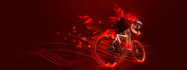 Creative artwork. Man, professional cyclist training, riding on red background with polygonal and...
