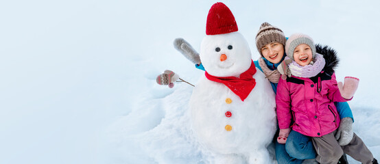 Winter fun for the family. Make a cute snowman who smiles broadly, decorate it in a warm knitted...