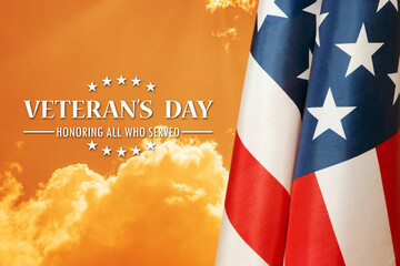 American flags with Text Veterans Day Honoring All Who Served on sunset background. American...