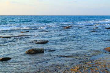 sea and beach in the golden hour light