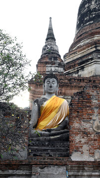 Ancient Buddha statue in an old temple at Wat Yai Chaimongkol Ayutthaya, Thailand, October 14, 2022, vertical photo, 